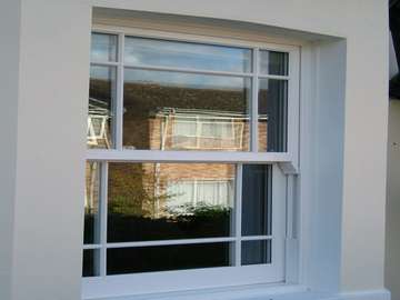 Formby Lancashire : Installation showing a Bygone White ash Upvc sliding sash window, showing features such as - run through Sash horns, Deep lower rail. Mortise joint fabrication 
